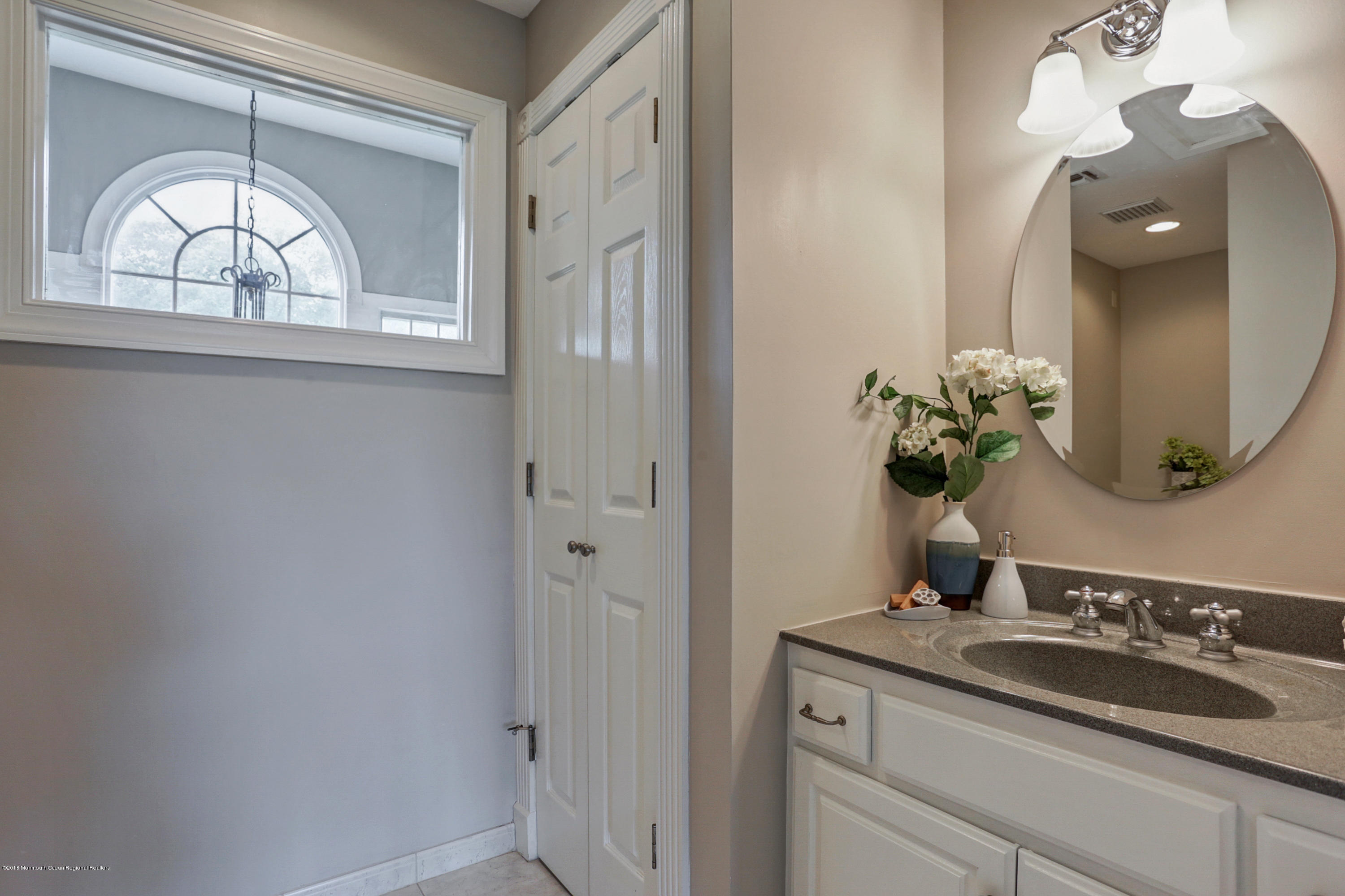 154 Lemon Road Farmingdale, NJ 07727 - Photo 40 of 43 a bathroom with a sink and a mirror