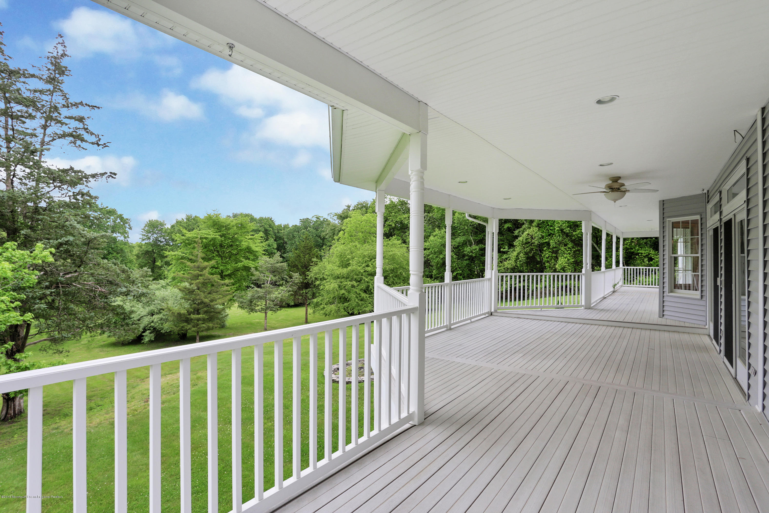 154 Lemon Road Farmingdale, NJ 07727 - Photo 8 of 43 a view of porch with wooden floor and fence