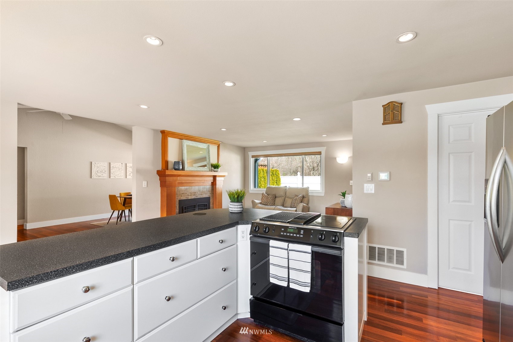 24204 Lockwood Road Bothell, WA 98021 - Photo 13 of 40 a kitchen with granite countertop a stove and a sink