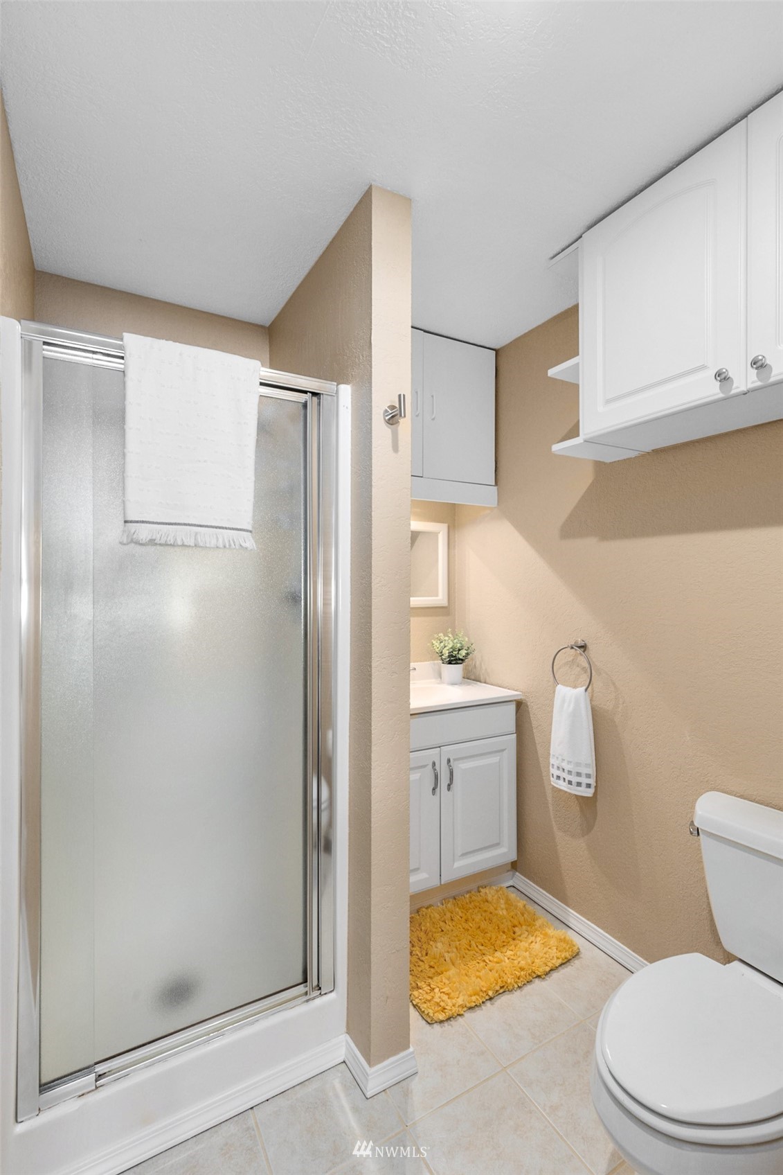24204 Lockwood Road Bothell, WA 98021 - Photo 15 of 40 a bathroom with a granite countertop bathtub shower sink vanity and toilet