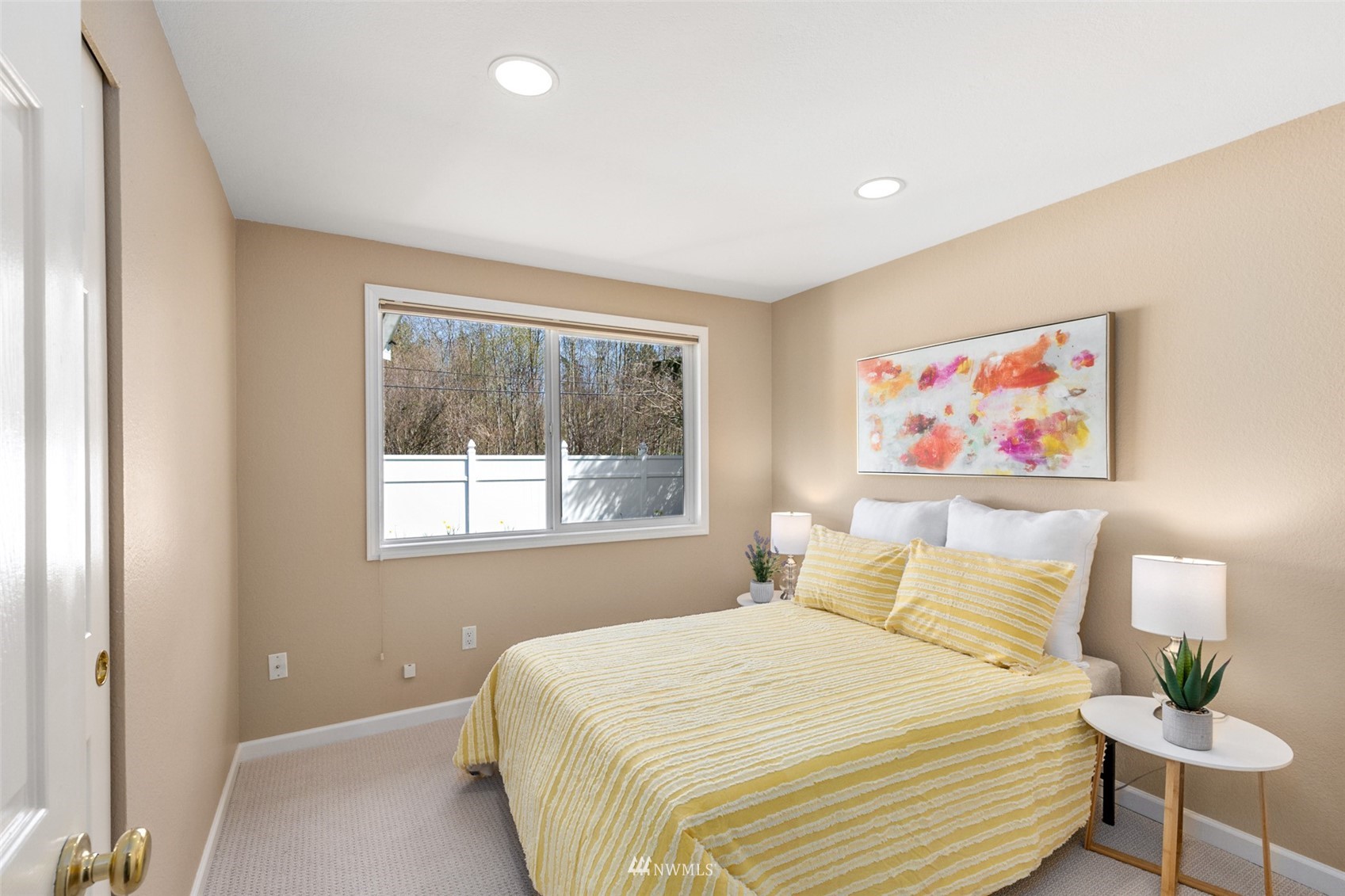 24204 Lockwood Road Bothell, WA 98021 - Photo 16 of 40 a bedroom with a bed and a painting on the wall