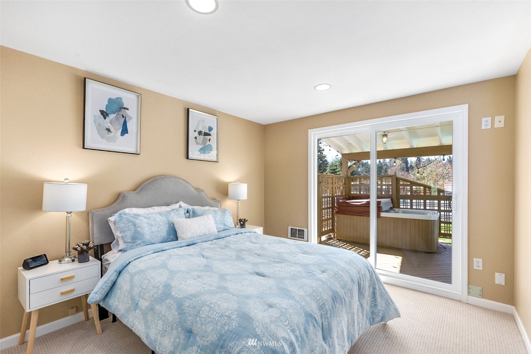 24204 Lockwood Road Bothell, WA 98021 - Photo 19 of 40 a bedroom with a large bed and a lamp