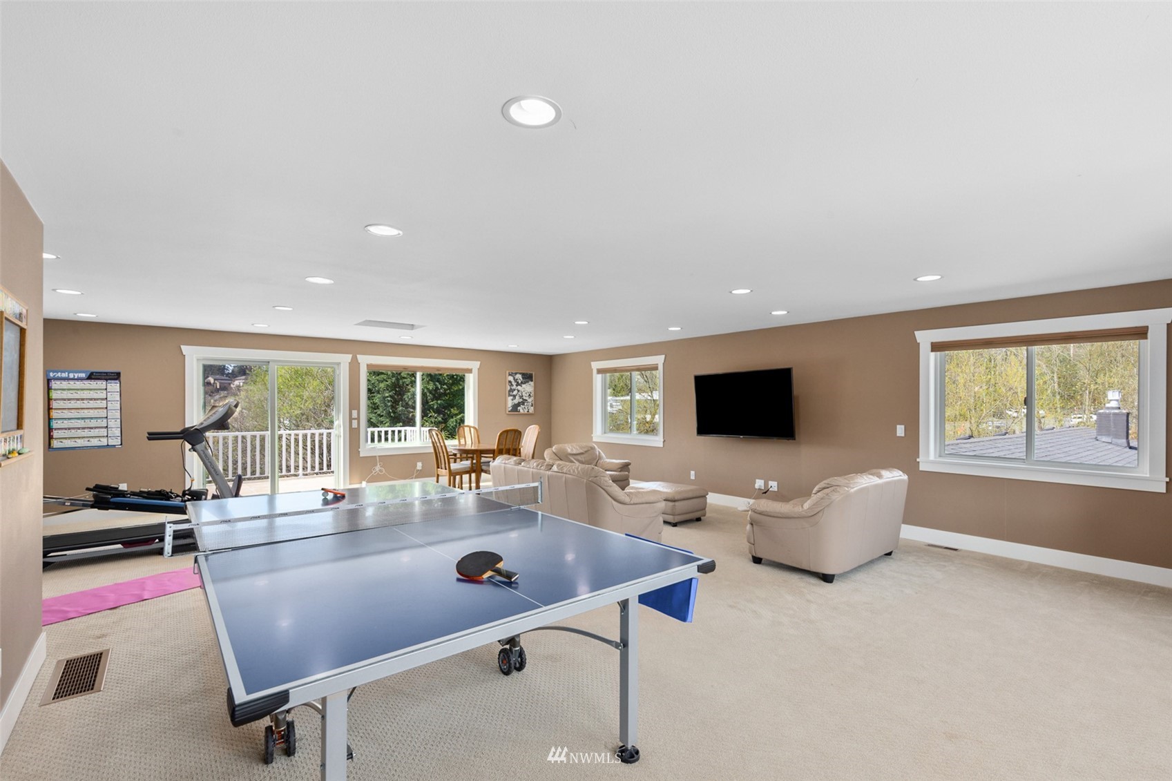 24204 Lockwood Road Bothell, WA 98021 - Photo 20 of 40 a living room with furniture and a flat screen tv