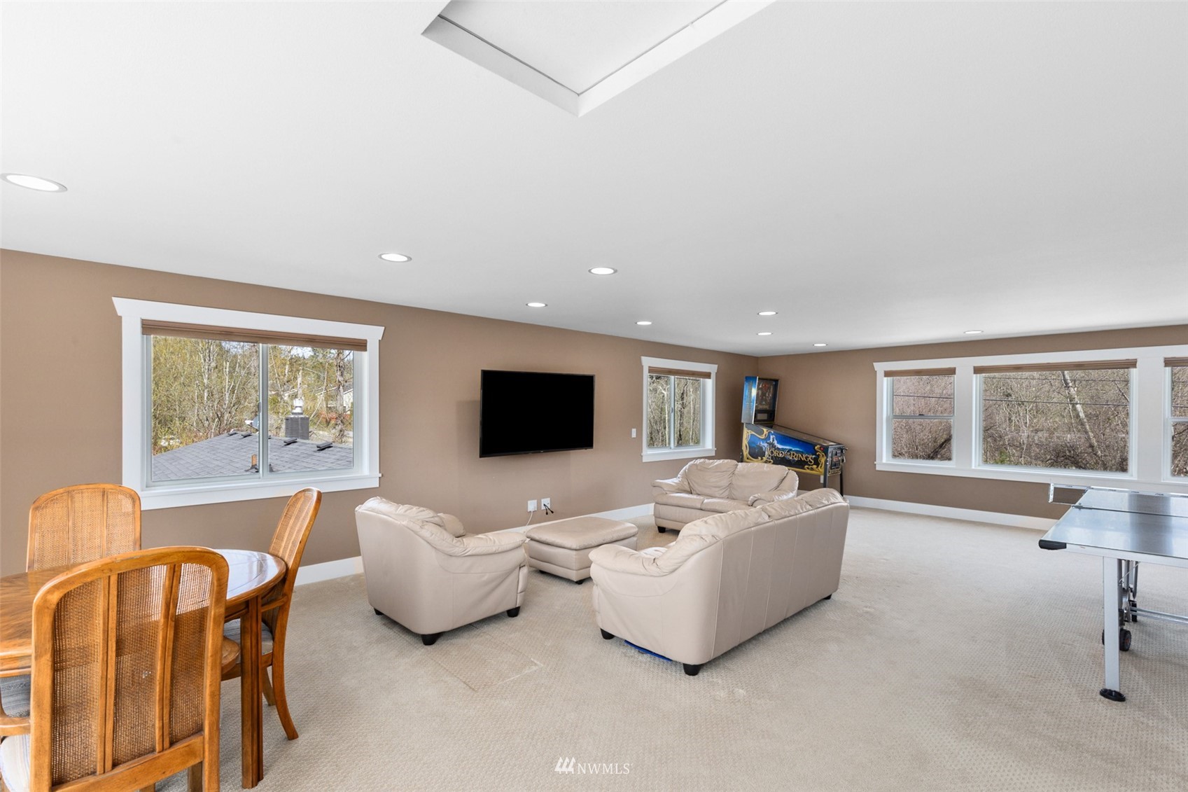 24204 Lockwood Road Bothell, WA 98021 - Photo 21 of 40 a living room with furniture and a flat screen tv