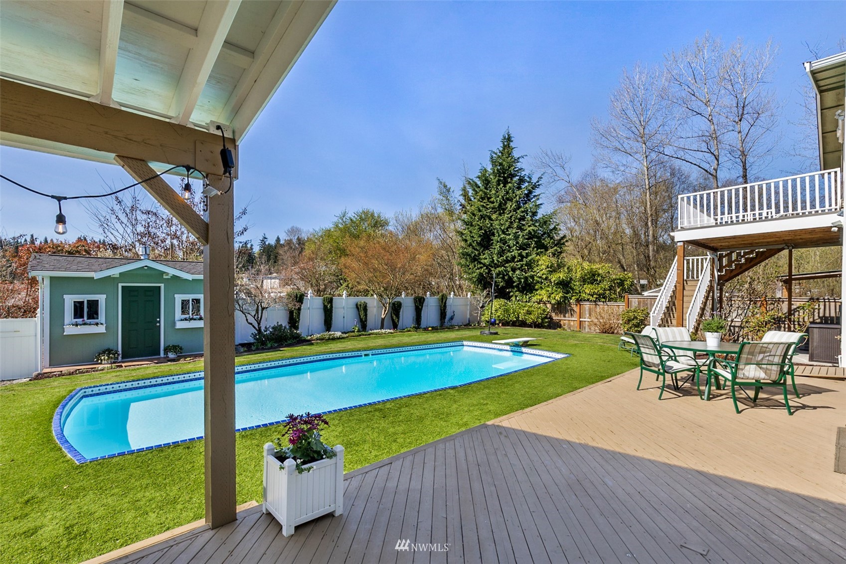 24204 Lockwood Road Bothell, WA 98021 - Photo 26 of 40 a view of a house with swimming pool and sitting area