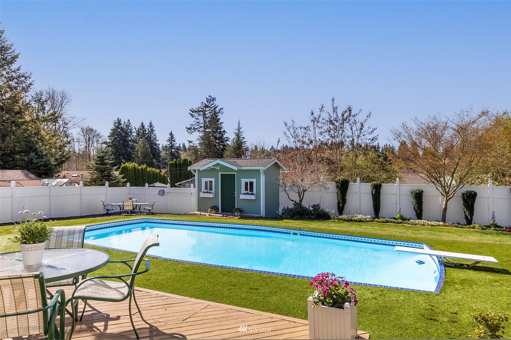 24204 Lockwood Road Bothell, WA 98021 - Photo 27 of 40 a view of house with swimming pool yard and outdoor seating