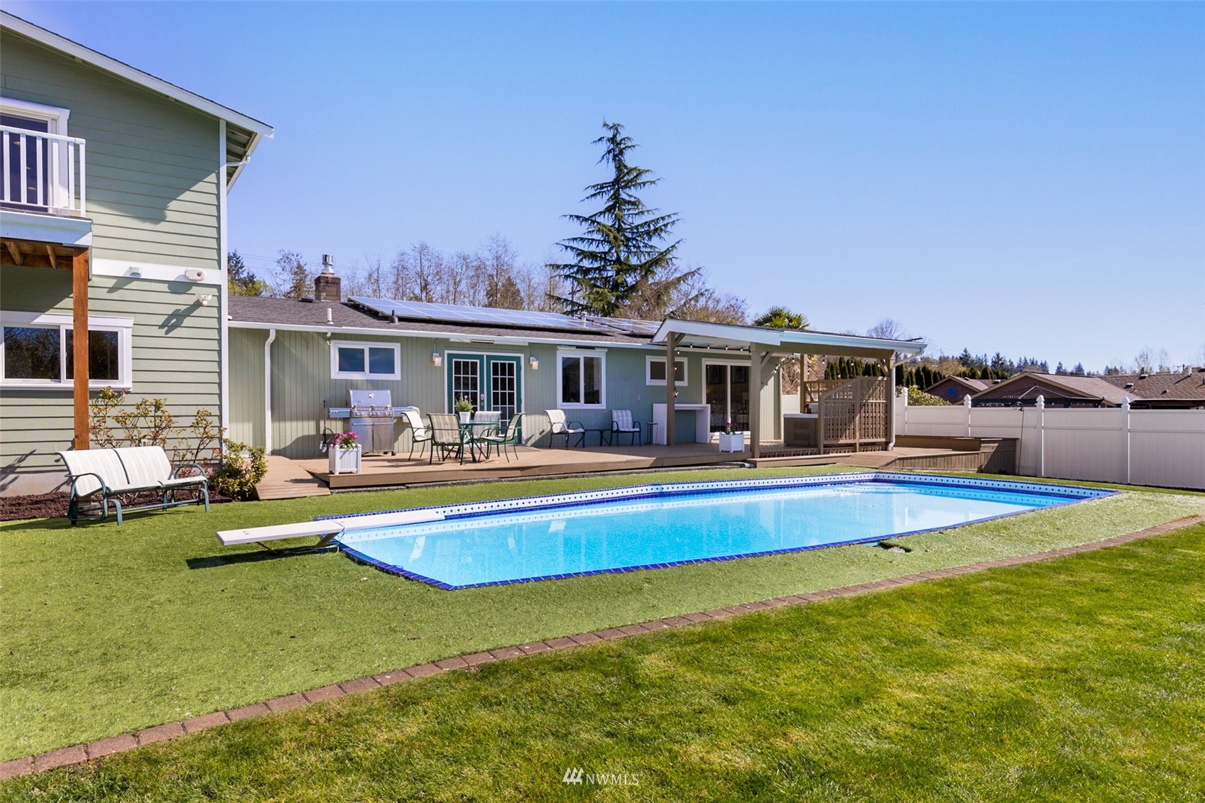 24204 Lockwood Road Bothell, WA 98021 - Photo 30 of 40 a view of a house with swimming pool and porch
