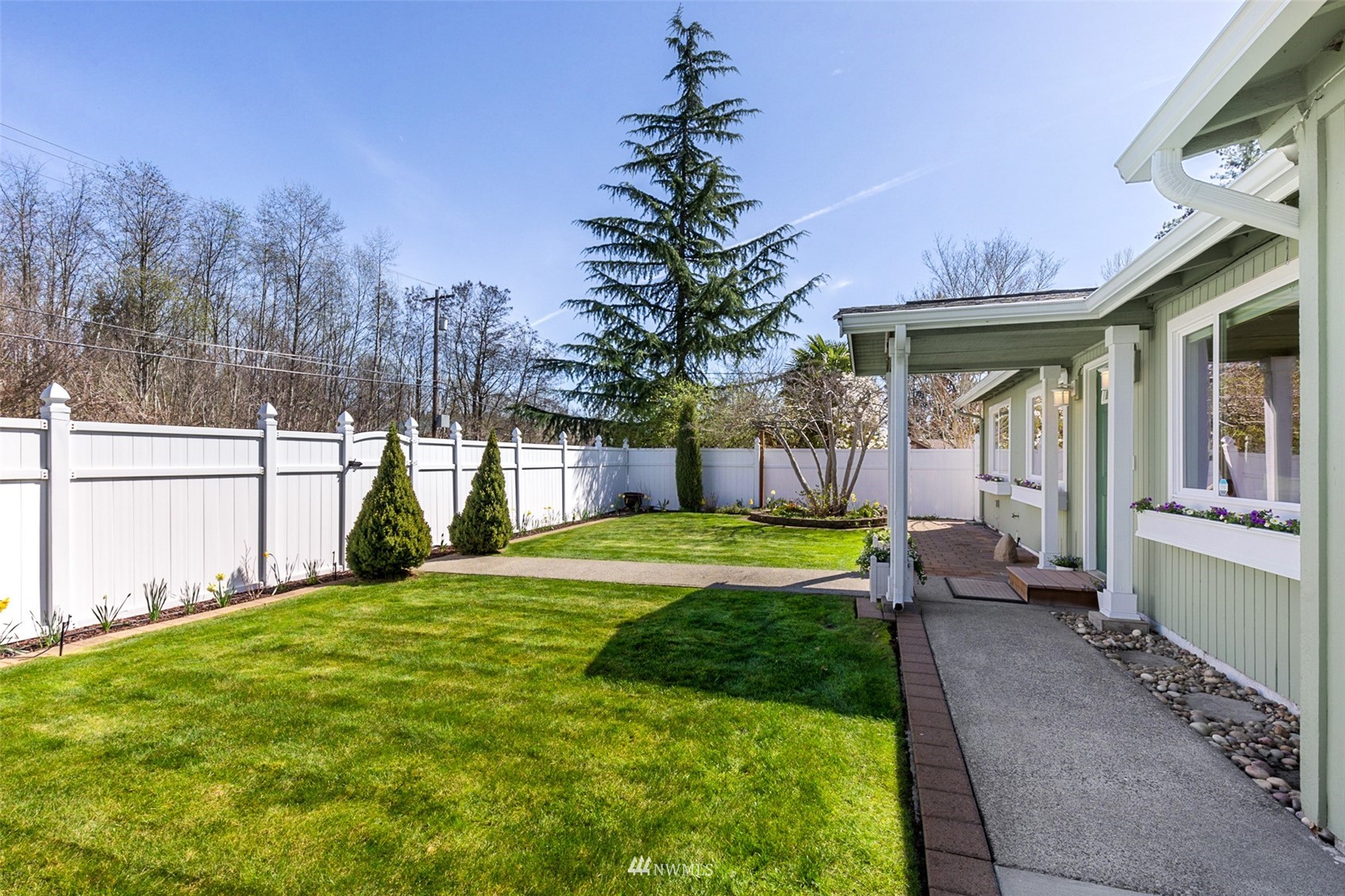 24204 Lockwood Road Bothell, WA 98021 - Photo 5 of 40 a view of a house with backyard and sitting area