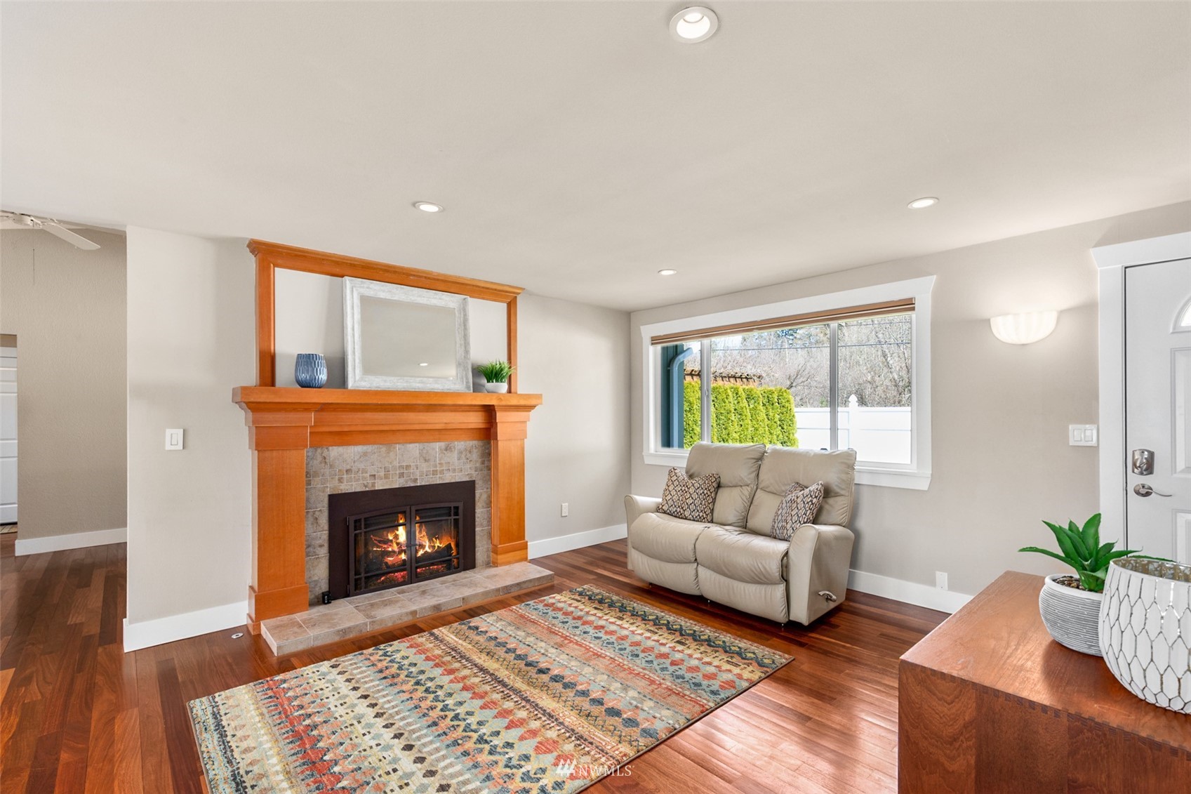 24204 Lockwood Road Bothell, WA 98021 - Photo 8 of 40 a living room with furniture and a fireplace