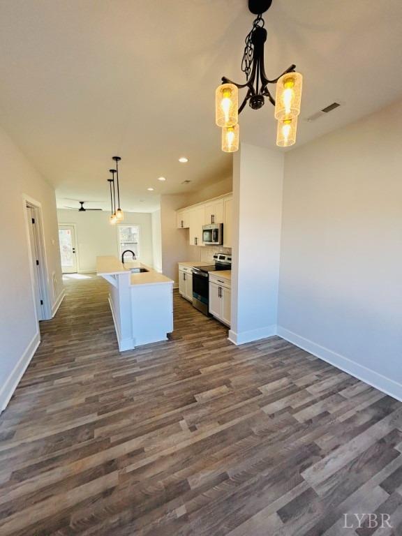 73 Allure Drive Rustburg, VA 24588 - Photo 4 of 13 a view of a kitchen with wooden floor and a chandelier