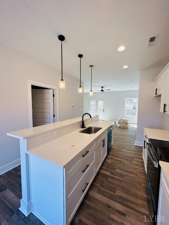 73 Allure Drive Rustburg, VA 24588 - Photo 6 of 13 a large kitchen with kitchen island a sink dishwasher a stove and a refrigerator with wooden floor