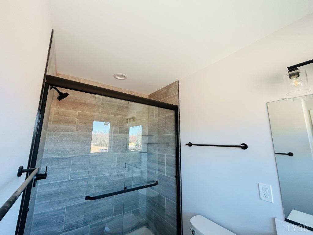 73 Allure Drive Rustburg, VA 24588 - Photo 10 of 13 a bathroom with a shower and toilet
