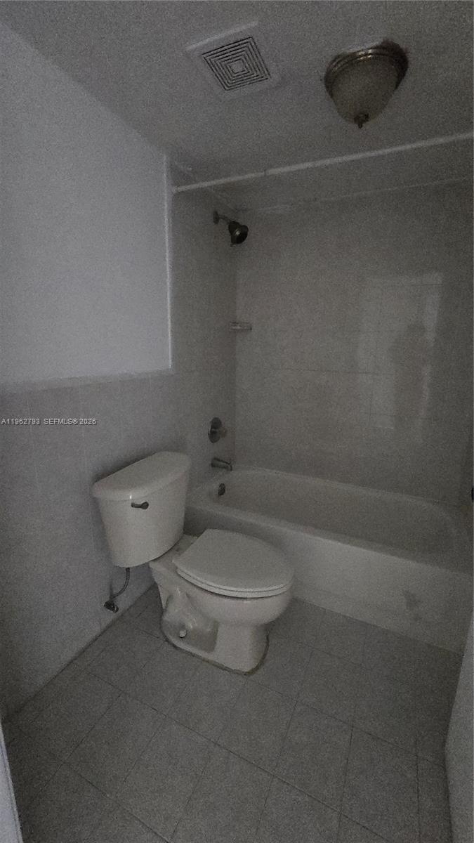8320 Northwest 8th Street, Unit 2110 Miami, FL 33126 - Photo 13 of 13 a bathroom with a toilet and a shower