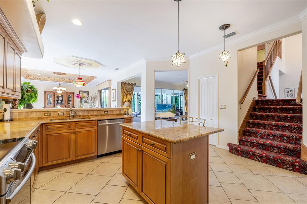 13881 Blenheim Trail Road Fort Myers, FL 33908 - Photo 18 of 82 a kitchen with stainless steel appliances granite countertop a sink and a stove