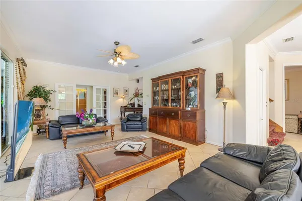 a bedroom with furniture and a wooden floor