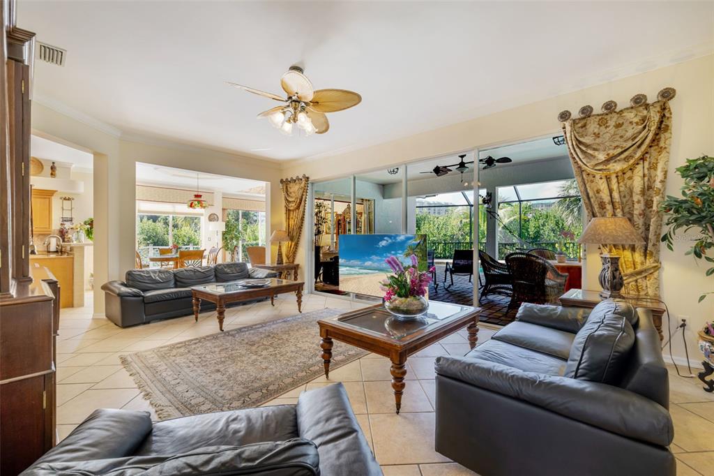 13881 Blenheim Trail Road Fort Myers, FL 33908 - Photo 22 of 82 a living room with furniture and a large window