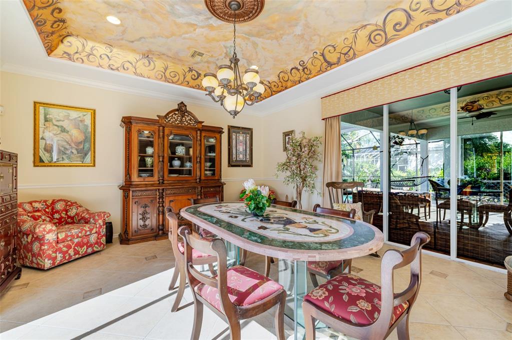 13881 Blenheim Trail Road Fort Myers, FL 33908 - Photo 24 of 82 a view of a dining room with furniture and chandelier