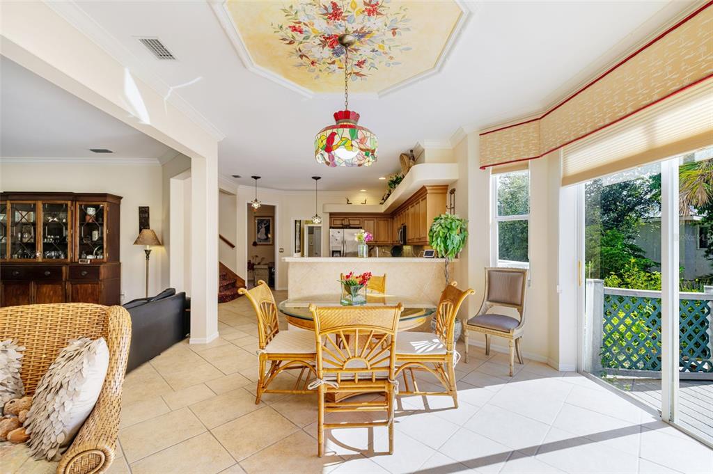13881 Blenheim Trail Road Fort Myers, FL 33908 - Photo 26 of 82 a view of a dining room with furniture wooden floor and chandelier