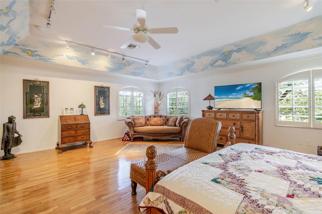 13881 Blenheim Trail Road Fort Myers, FL 33908 - Photo 35 of 82 a bedroom with a bed and furniture with wooden floor