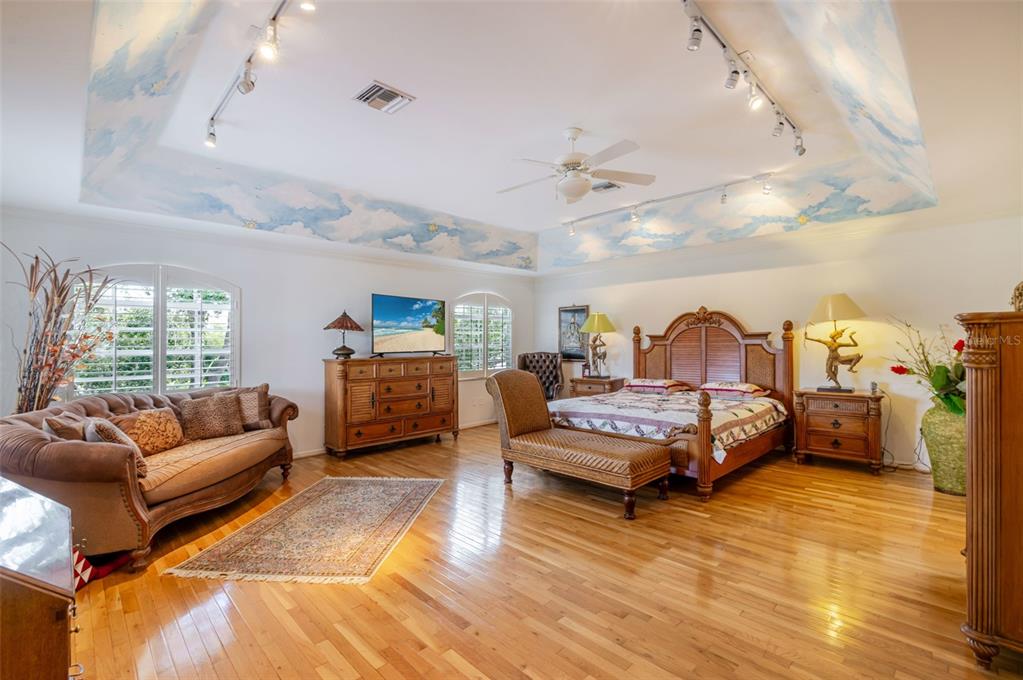 13881 Blenheim Trail Road Fort Myers, FL 33908 - Photo 36 of 82 a bedroom with furniture and a wooden floor