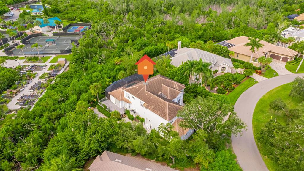 13881 Blenheim Trail Road Fort Myers, FL 33908 - Photo 70 of 82 an aerial view of a house with a yard and trees
