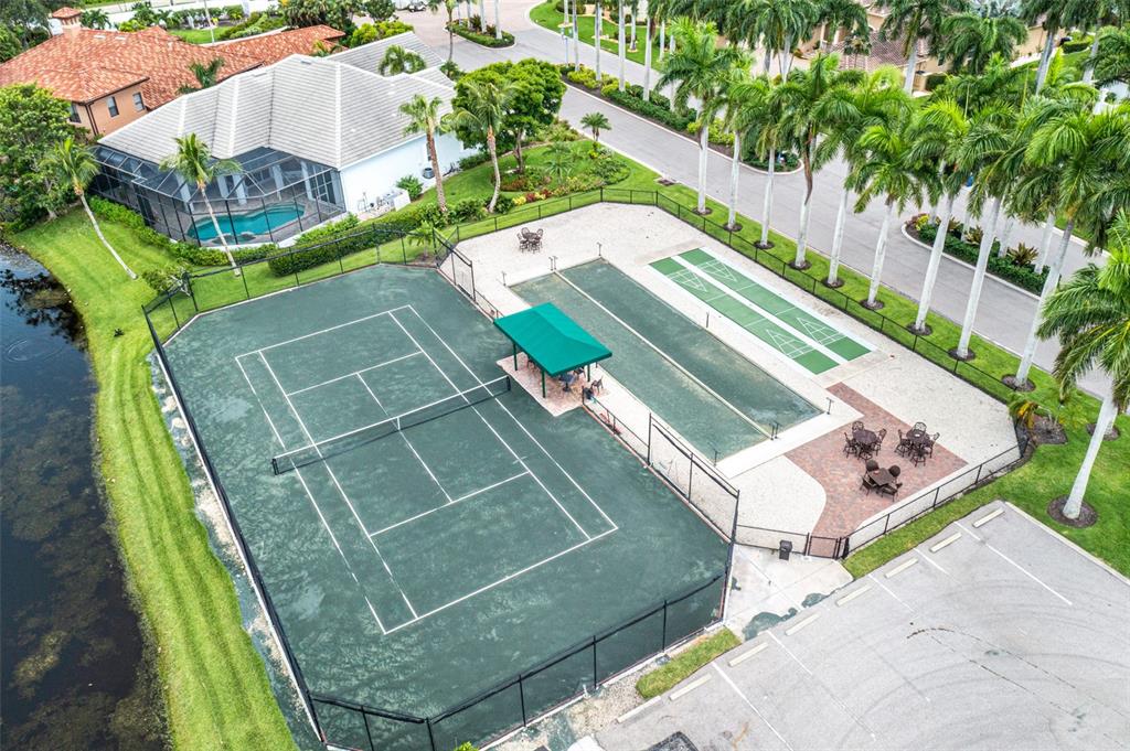13881 Blenheim Trail Road Fort Myers, FL 33908 - Photo 79 of 82 a view of a tennis ground with large trees