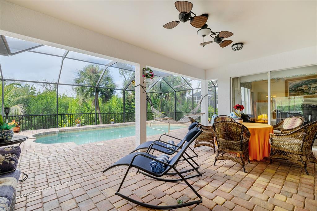 13881 Blenheim Trail Road Fort Myers, FL 33908 - Photo 8 of 82 a living room with furniture and a floor to ceiling window