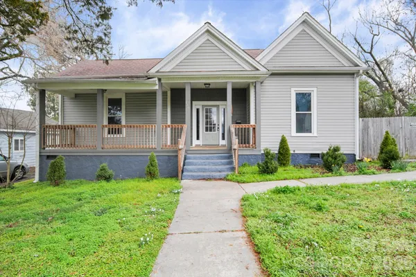 a front view of a house with yard