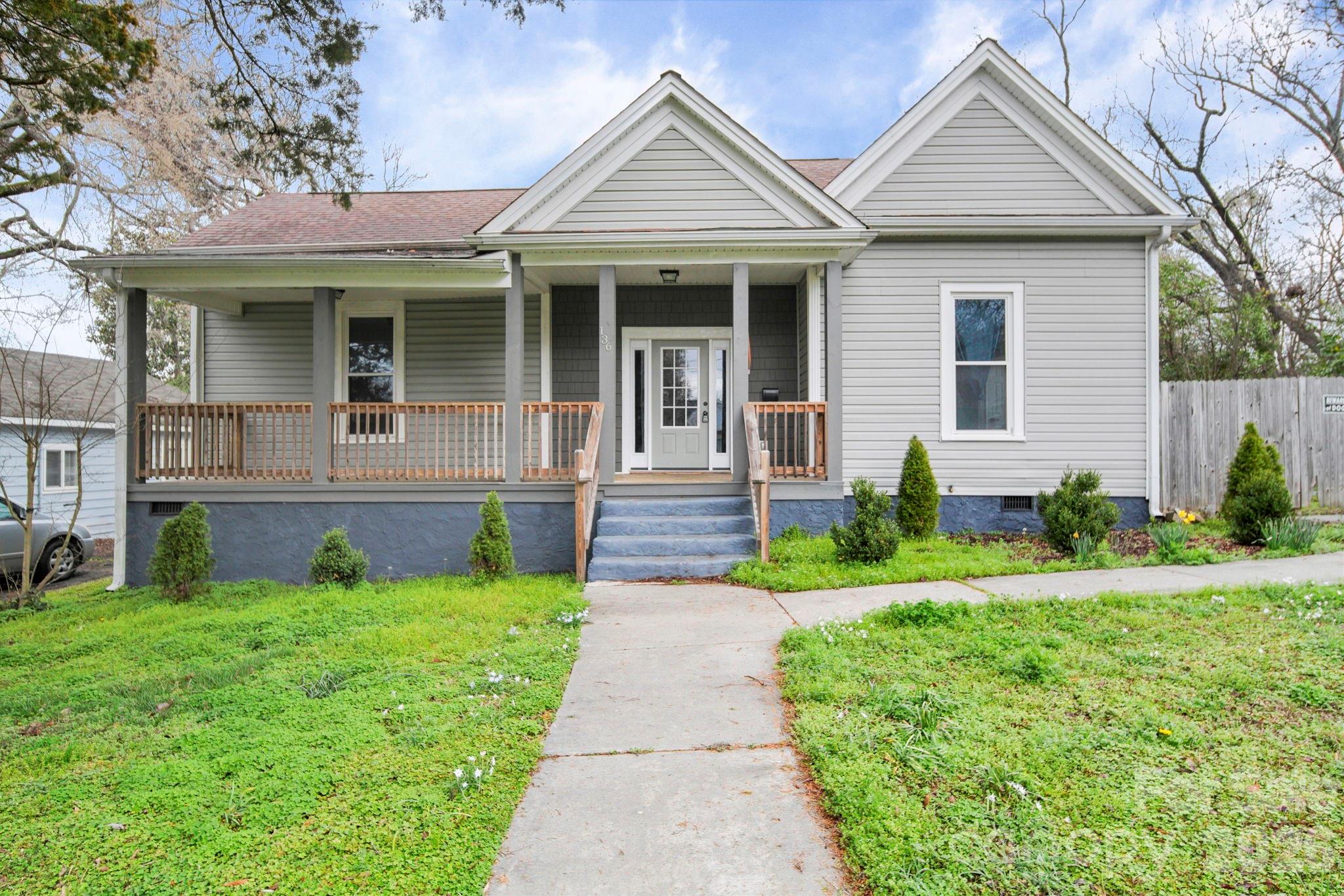 136 East Lacy Street Chester, SC 29706 - Photo 1 of 18 a front view of a house with yard