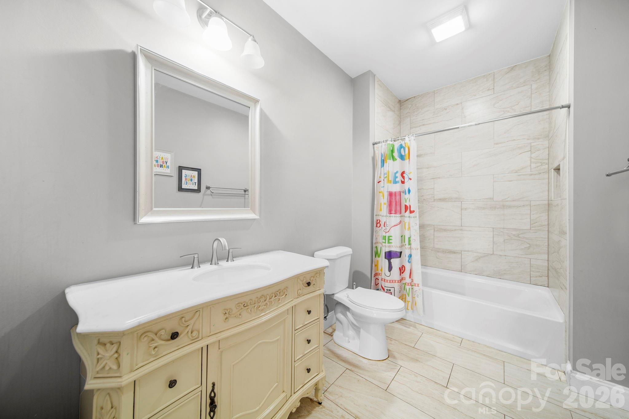 136 East Lacy Street Chester, SC 29706 - Photo 13 of 18 a bathroom with a sink a toilet and shower