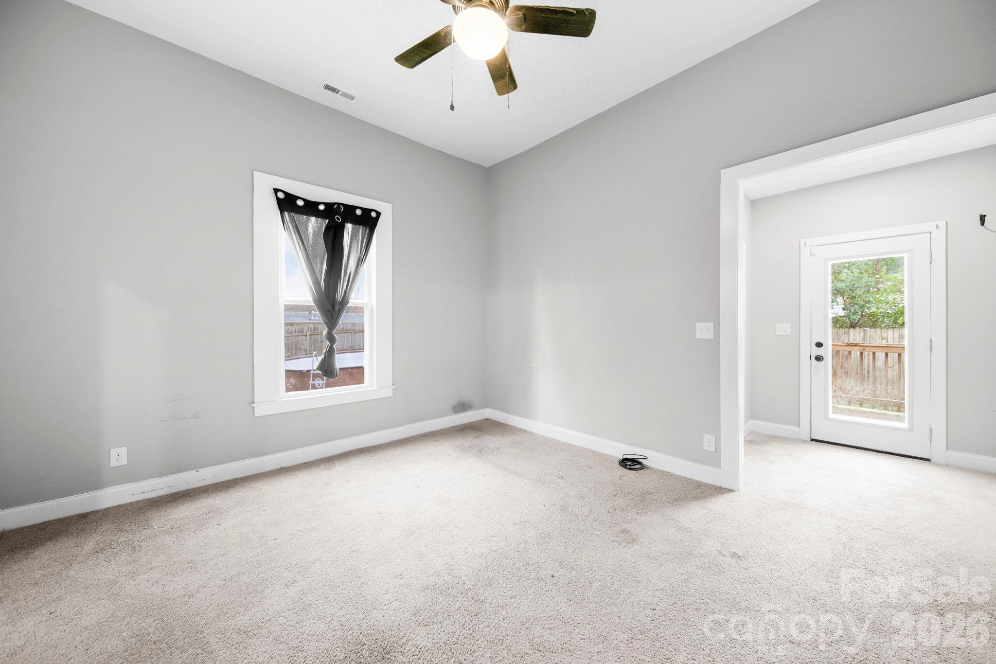 136 East Lacy Street Chester, SC 29706 - Photo 15 of 18 an empty room with windows and closet