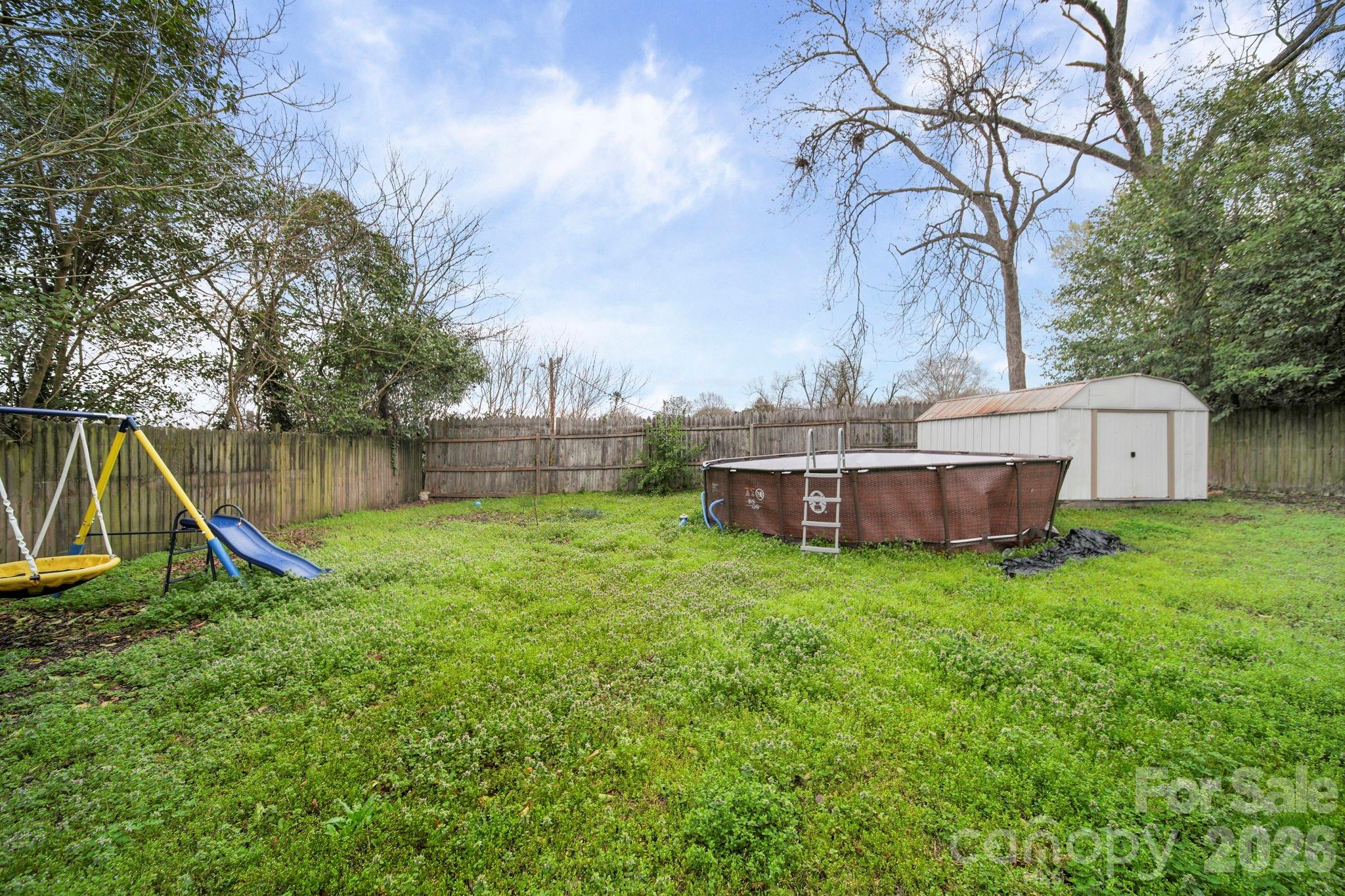 136 East Lacy Street Chester, SC 29706 - Photo 18 of 18 a view of a house with a yard and a slide