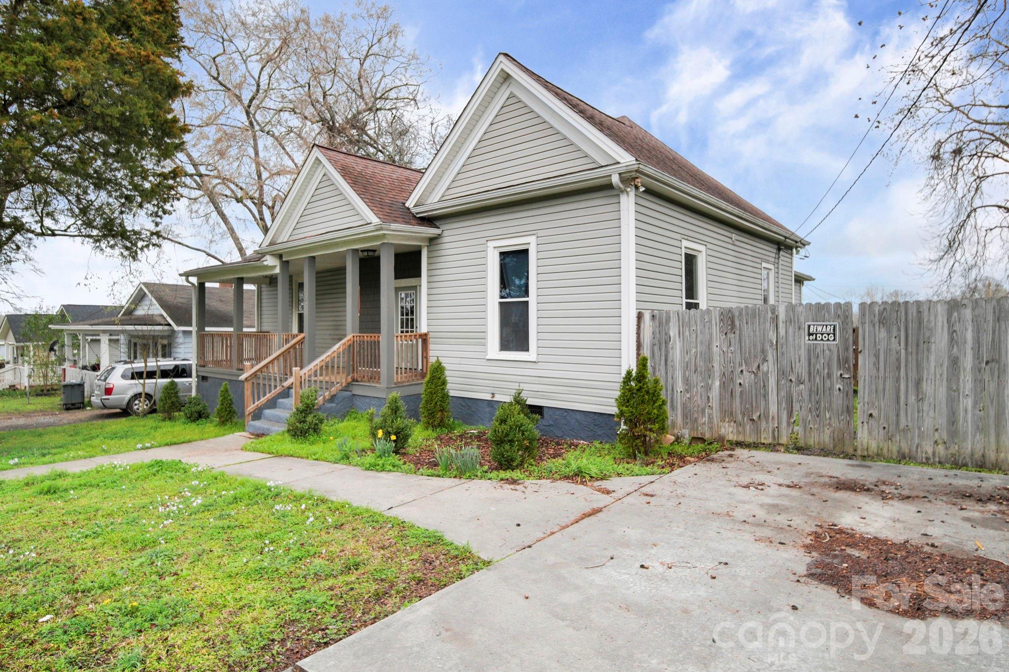136 East Lacy Street Chester, SC 29706 - Photo 3 of 18 a front view of a house with a yard and porch