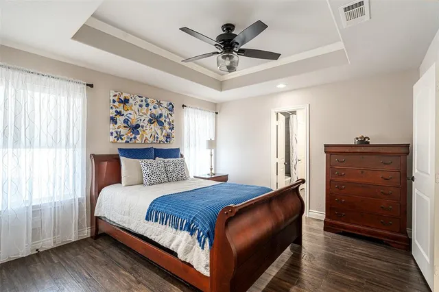 a bedroom with a bed and a dresser