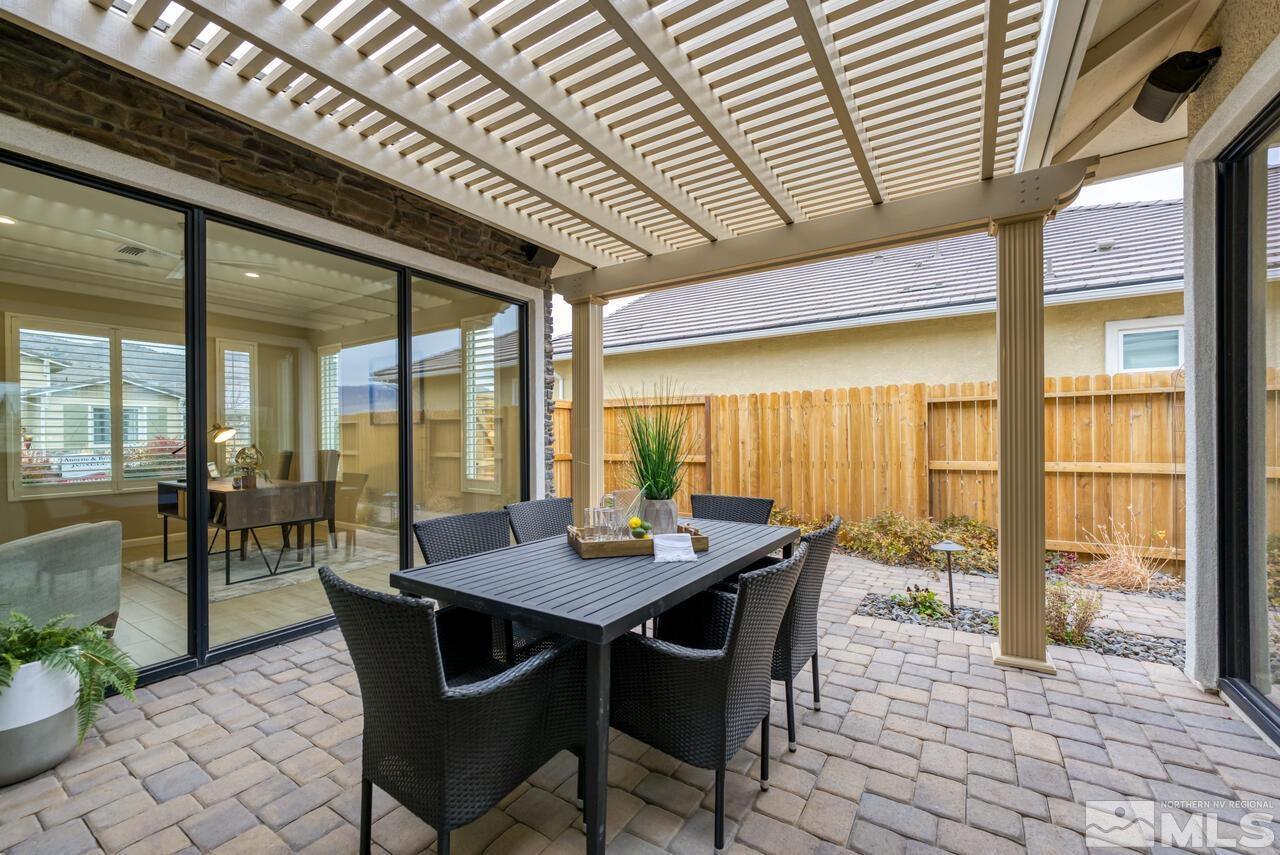 9915 Hafflinger Lane Reno, NV 89521 - Photo 33 of 40 a view of a dining room with furniture window and outside view