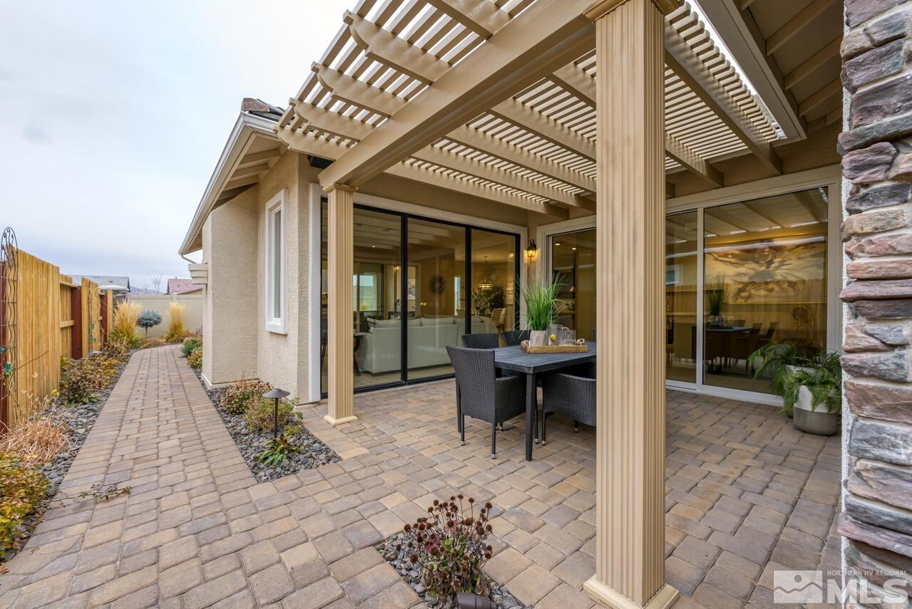 9915 Hafflinger Lane Reno, NV 89521 - Photo 34 of 40 a view of a patio with table and chairs