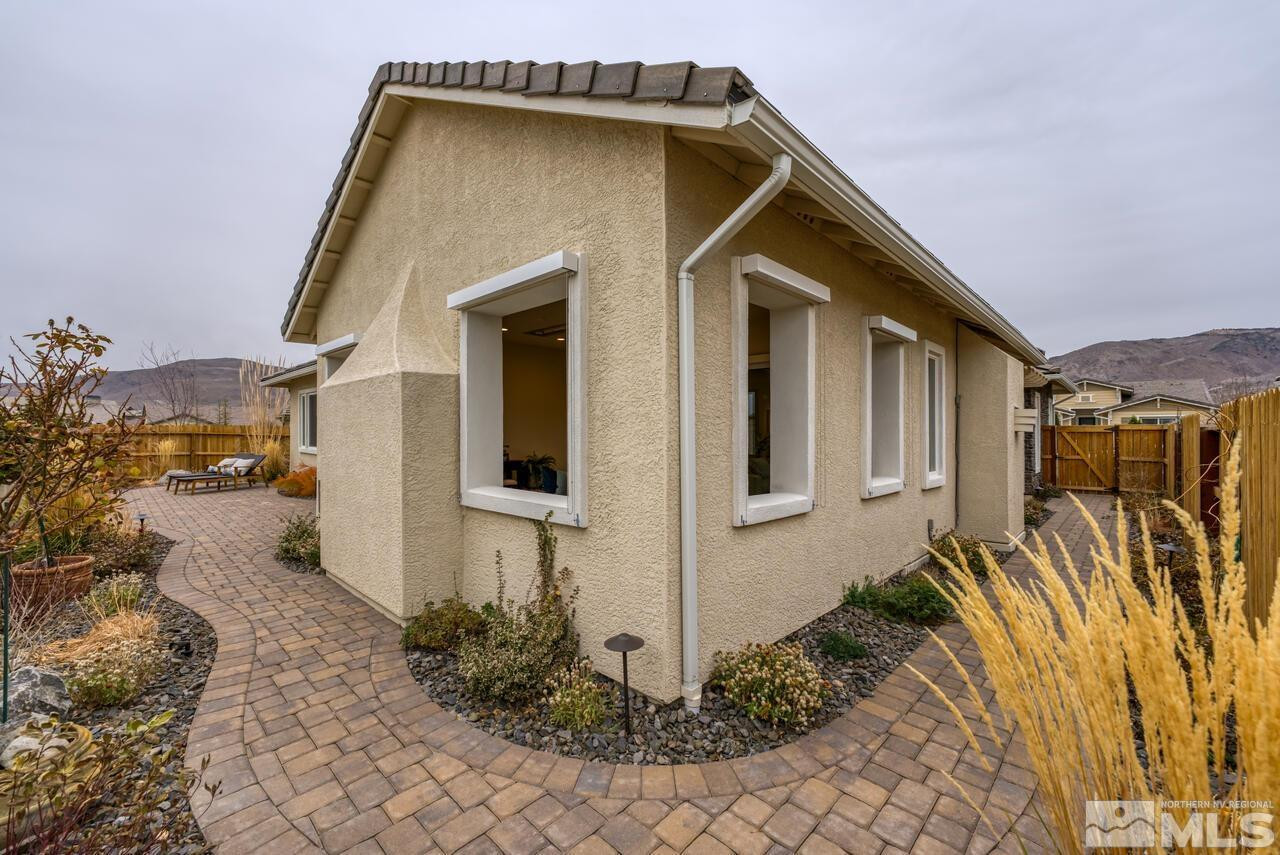 9915 Hafflinger Lane Reno, NV 89521 - Photo 36 of 40 a front view of a house with garden