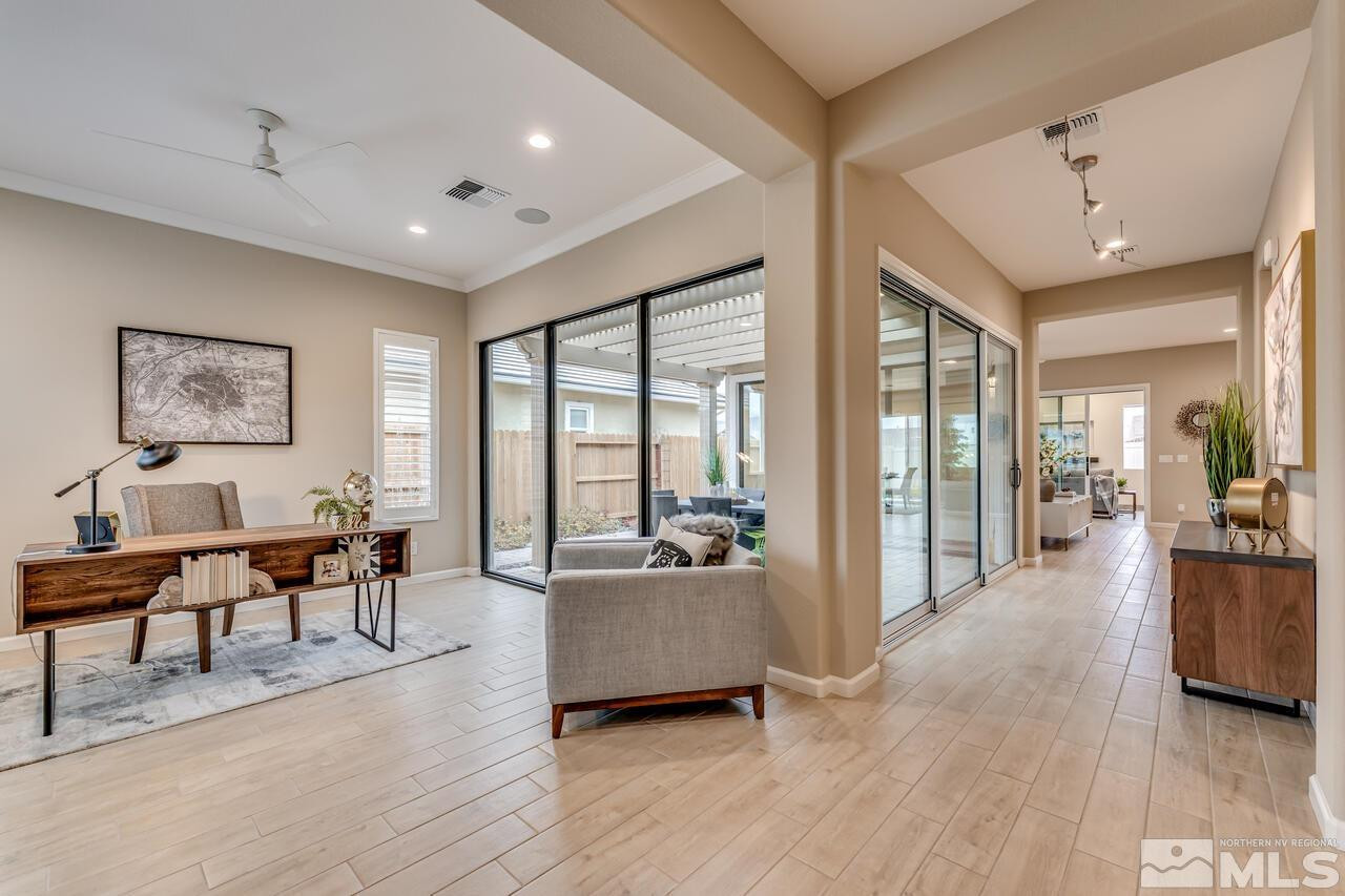 9915 Hafflinger Lane Reno, NV 89521 - Photo 4 of 40 a living room with furniture and a large window