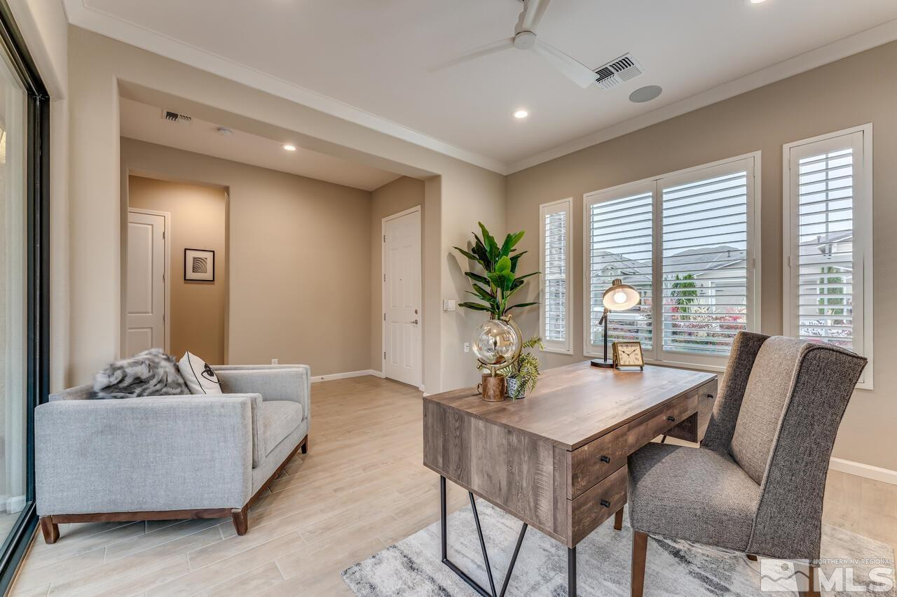 9915 Hafflinger Lane Reno, NV 89521 - Photo 6 of 40 a living room with furniture and a potted plant
