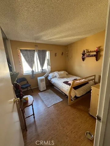 a bedroom with furniture and a window