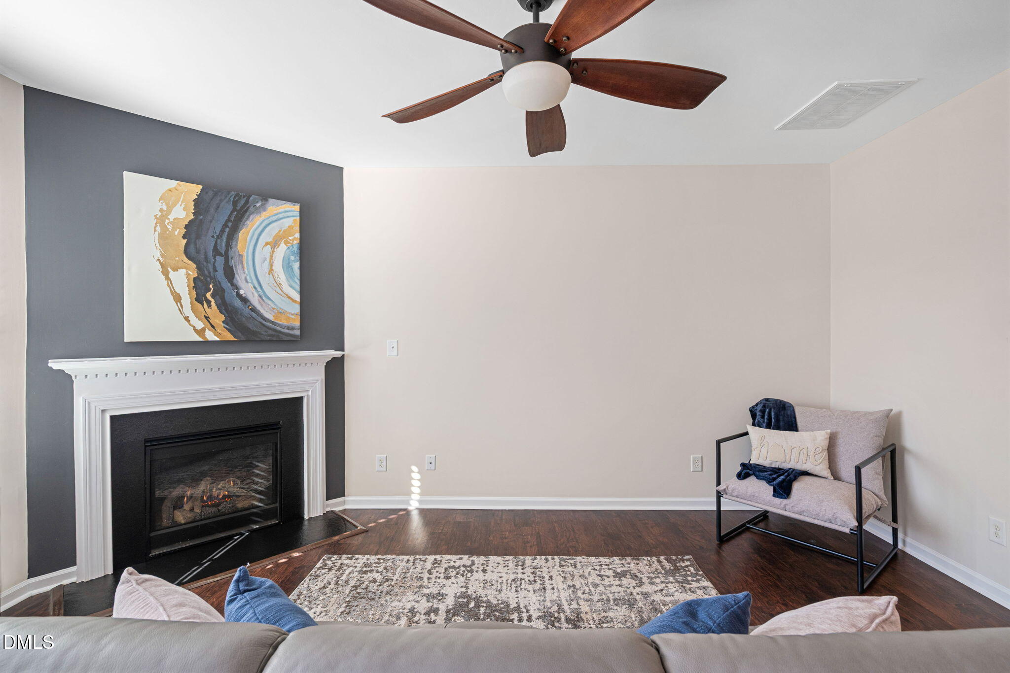 107 Ransomwood Drive Apex, NC 27539 - Photo 13 of 42 a living room with furniture and a fireplace