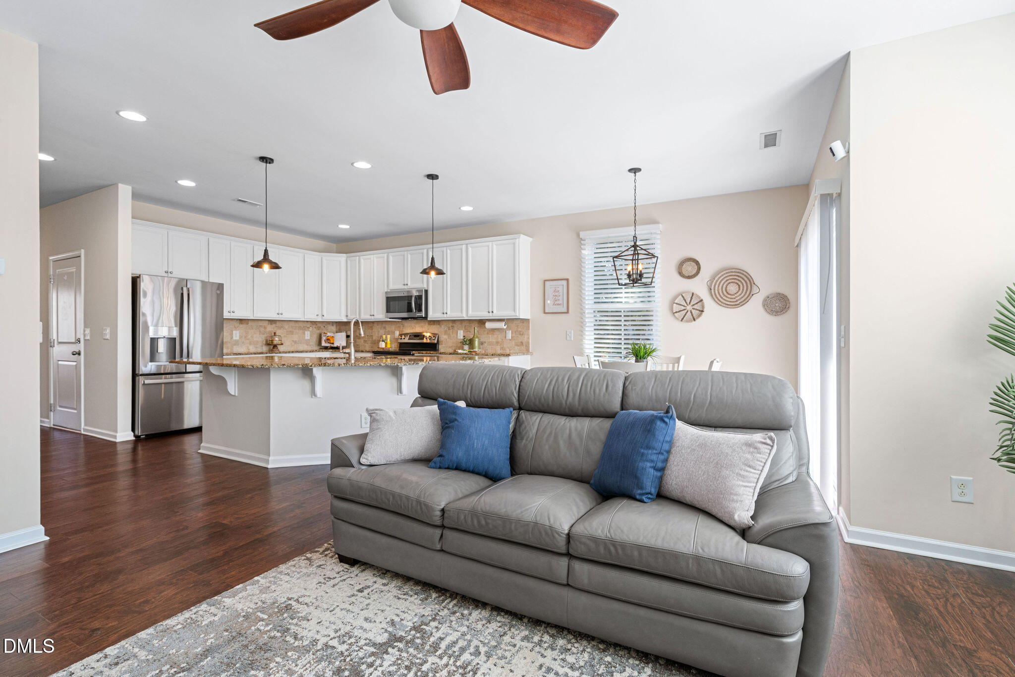 107 Ransomwood Drive Apex, NC 27539 - Photo 15 of 42 a living room with stainless steel appliances furniture and a kitchen view