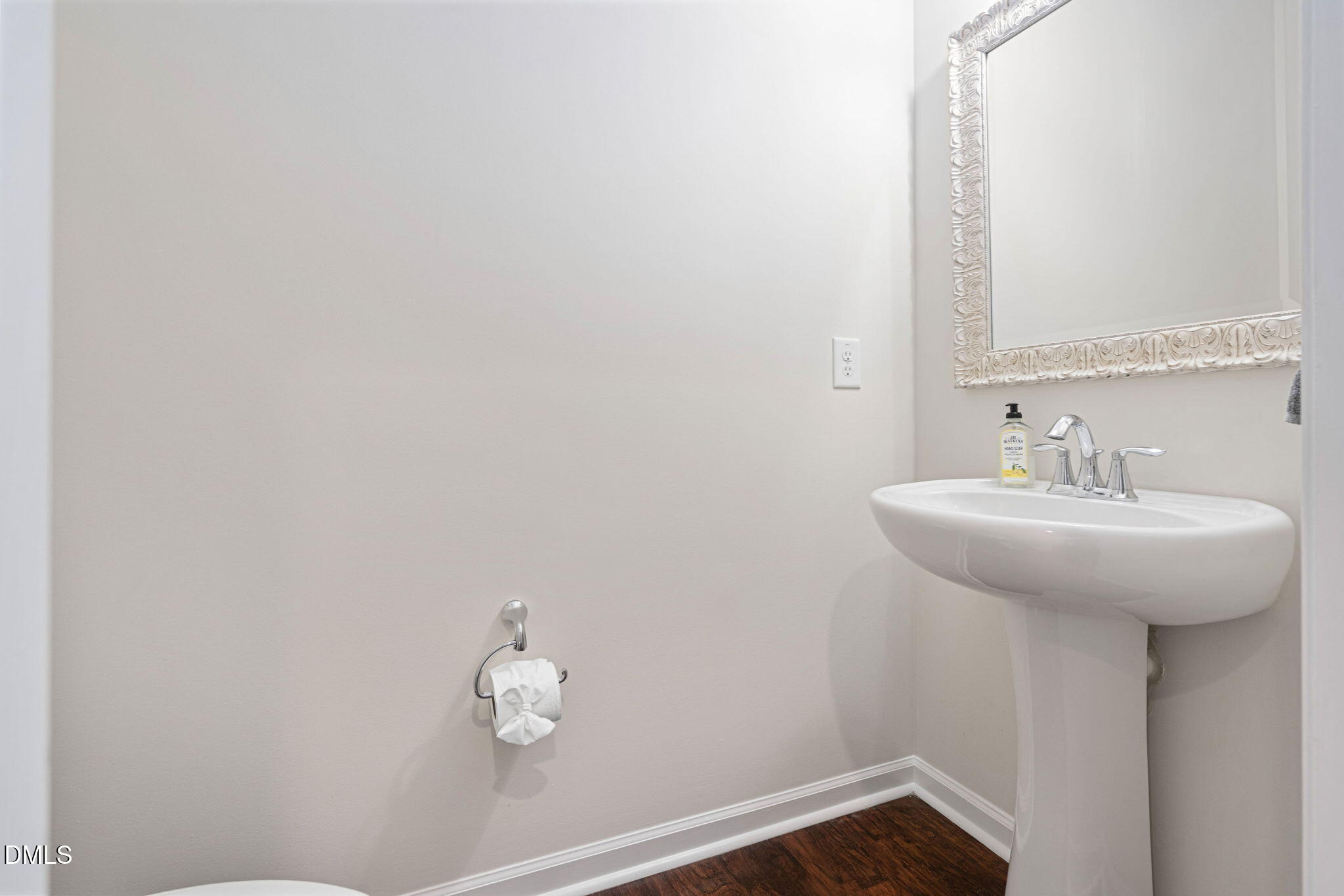 107 Ransomwood Drive Apex, NC 27539 - Photo 22 of 42 a bathroom with a sink and mirror