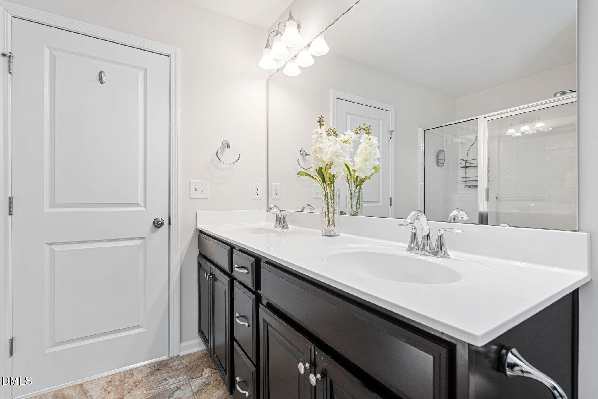 107 Ransomwood Drive Apex, NC 27539 - Photo 27 of 42 a bathroom with a sink vanity and a mirror