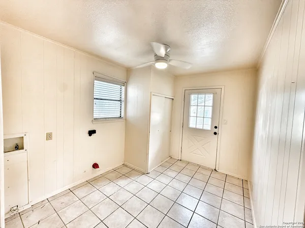 a view of an empty room and window