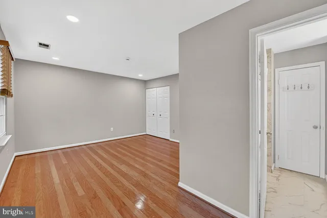 wooden floor in a hall with an entryway