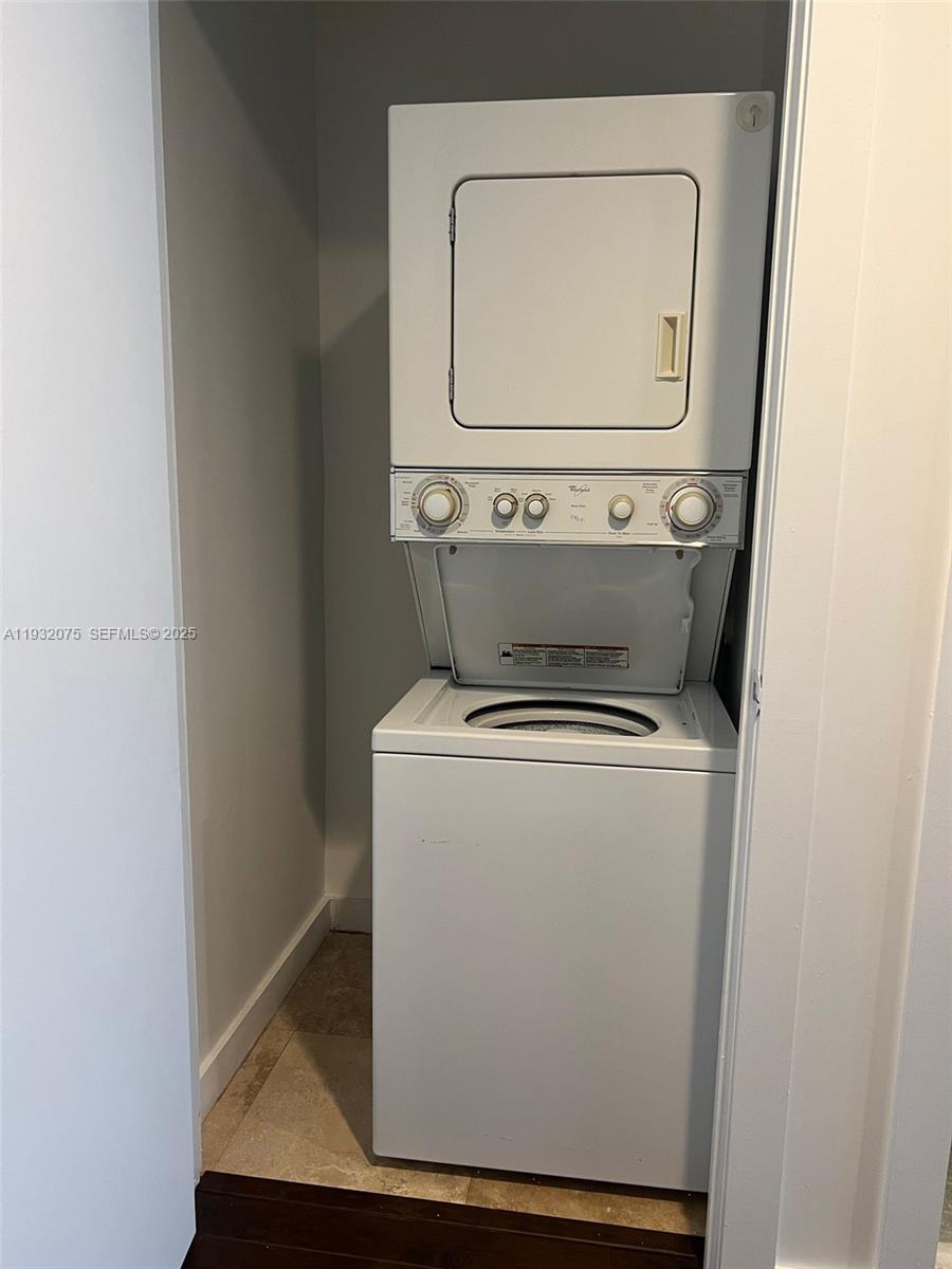 1050 Brickell Avenue, Unit 3122 Miami, FL 33131 - Photo 12 of 31 a utility room with dryer and washer