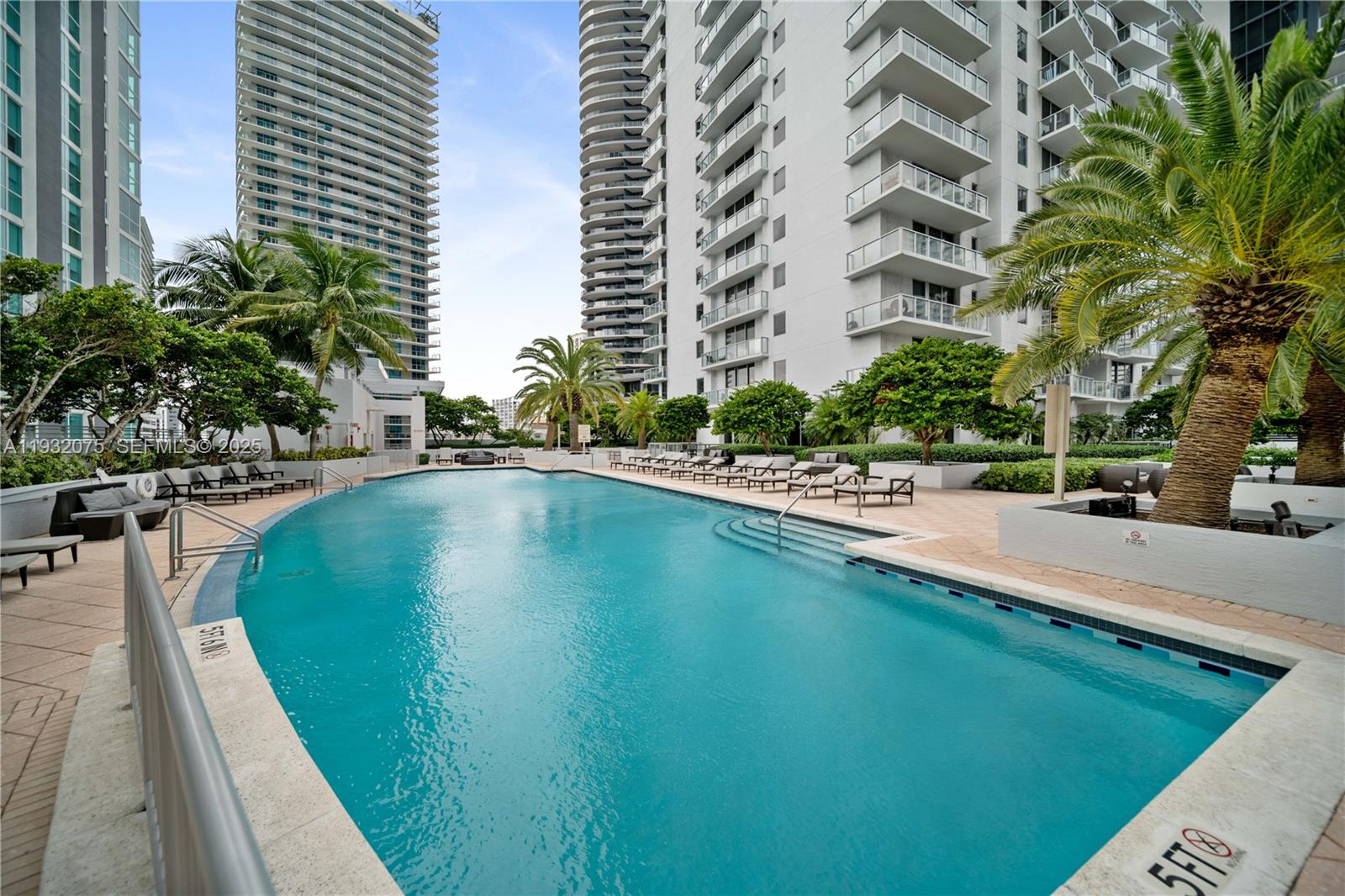1050 Brickell Avenue, Unit 3122 Miami, FL 33131 - Photo 21 of 31 a swimming pool with outdoor seating and yard