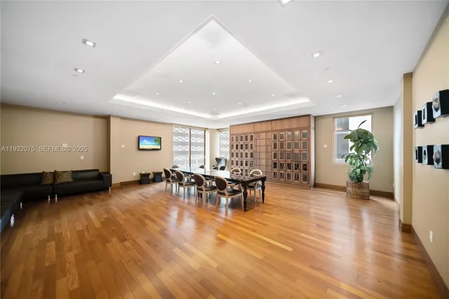 a kitchen with a sink stainless steel appliances a refrigerator and a stove