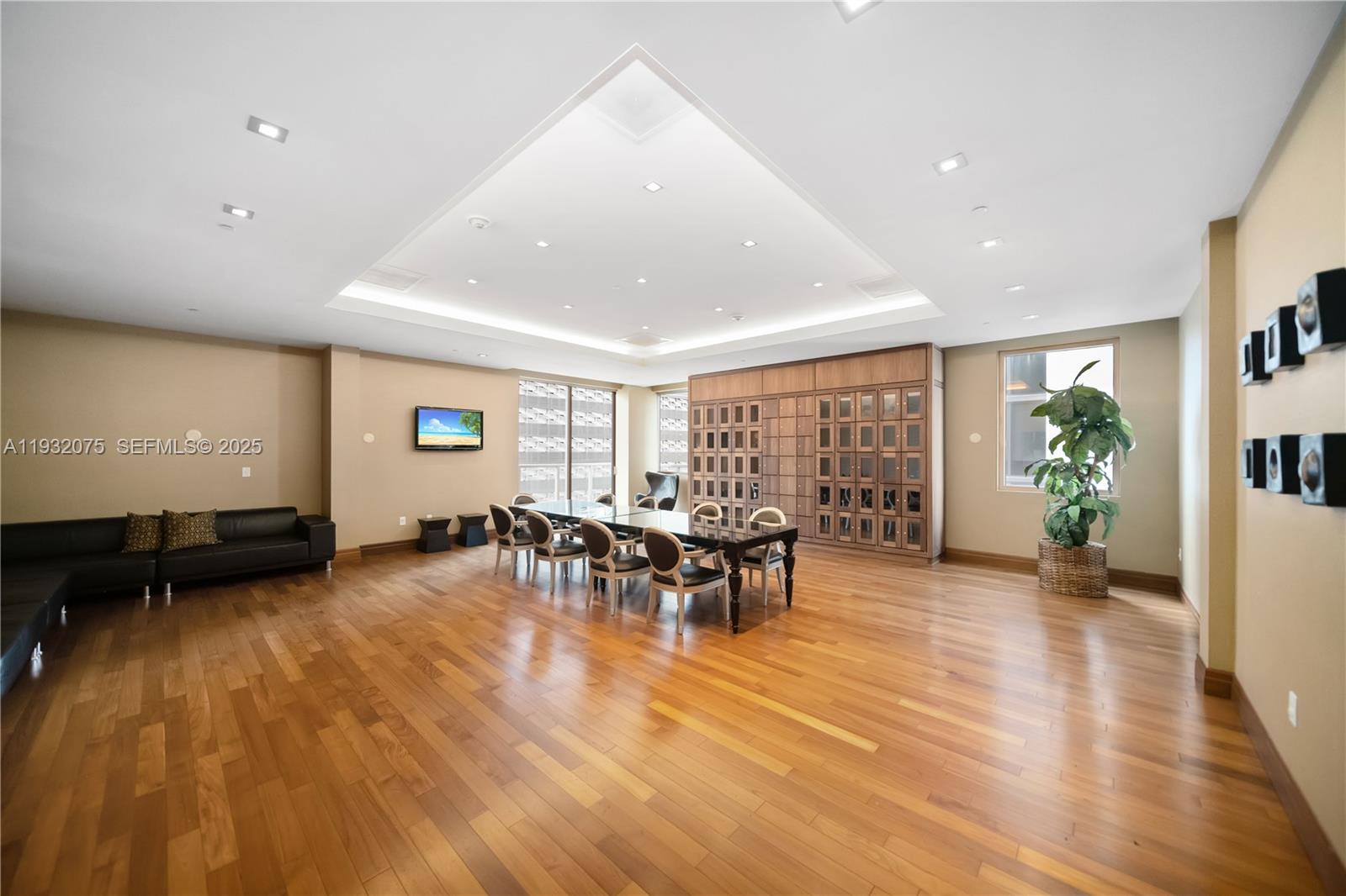 1050 Brickell Avenue, Unit 3122 Miami, FL 33131 - Photo 27 of 31 a view of a large dining room with furniture window and wooden floor